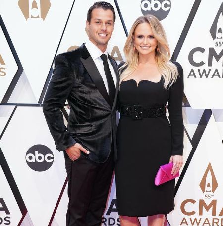 Miranda Lambert with her spouse Brendan McLoughlin at an award show.